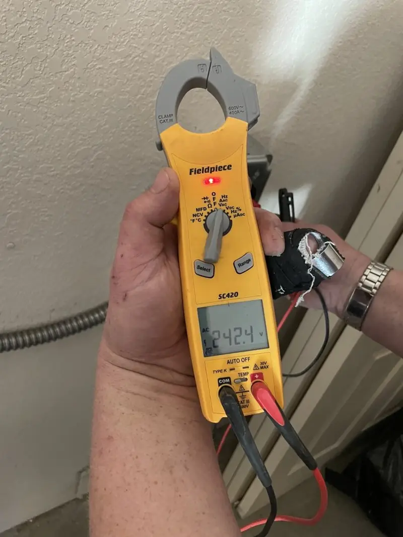 Voltage testing with clamp meter during Whole House Surge Protector in Macomb